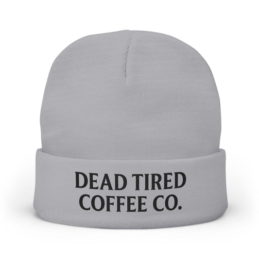 Gray beanie with 'DEAD TIRED COFFEE CO.' text on a white background